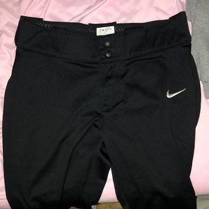 Medium Nike softball pants. Black, and I can include a black belt too:)